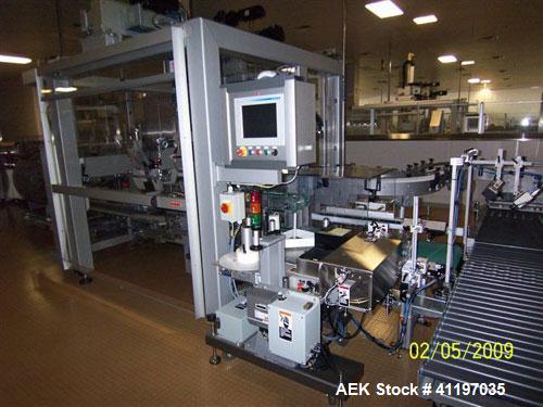 Used Cermex Sidel model SD59 top loading case packer capable of speeds up to 28 case per minute. Has automatic collation, AB PLC controls, tape seal system.