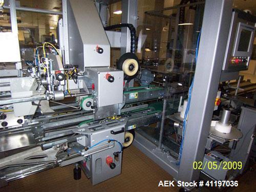 Used Cermex Sidel model SD59 top loading case packer capable of speeds up to 28 case per minute. Has automatic collation, AB PLC controls, tape seal system.