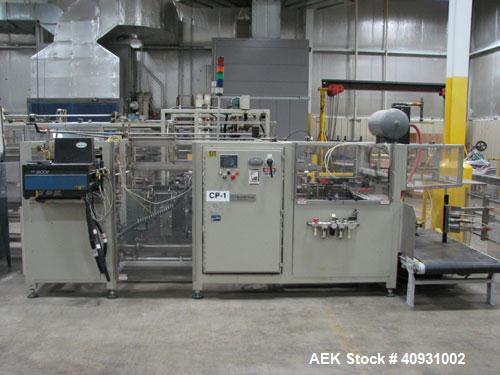 Used Smurfit-Stone Packomatic Model 1588 Case Former and Packer. New 2002. Up to 25 cases per hour, maximum case size 24" long x 16" wide x 20" deep, Nordson series 3500V gluer.