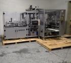 Used Skinetta Top Loading Case Erector Packer, Model CP 150. Servo driven loading head, with powered case feeder and case erector. Integrated top and bottom case taper. Includes controls. 3/60/480 Vo...