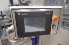 Used Skinetta Top Loading Case Erector Packer, Model CP 150. Servo driven loading head, with powered case feeder and case erector. Integrated top and bottom case taper. Includes controls. 3/60/480 Vo...