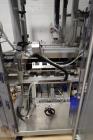 Used Skinetta Top Loading Case Erector Packer, Model CP 150. Servo driven loading head, with powered case feeder and case erector. Integrated top and bottom case taper. Includes controls. 3/60/480 Vo...