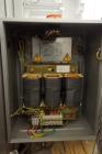 Used Skinetta Top Loading Case Erector Packer, Model CP 150. Servo driven loading head, with powered case feeder and case erector. Integrated top and bottom case taper. Includes controls. 3/60/480 Vo...
