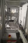Used Skinetta Top Loading Case Erector Packer, Model CP 150. Servo driven loading head, with powered case feeder and case erector. Integrated top and bottom case taper. Includes controls. 3/60/480 Vo...