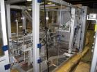 Used Skinetta CP150 Automatic Top Load Robotic Case Erector, Packer And Sealer. Has AB PLC controls, tape seal system and was last running bundles into top load case. Packer Erector / Sealer CP 150. ...