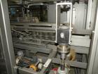 Used Rockford Midland Case Packer, Model  808TS. Last running at speeds of 200 cpm. Has down stacker, AB SLC 5/03 PLC controller. Max case size: 15