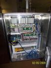 Used Cermex Sidel model SD59 top loading case packer capable of speeds up to 28 case per minute. Has automatic collation, AB PLC controls, tape seal system.