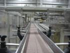 Used Smurfit-Stone Packomatic Model 1588 Case Former and Packer. New 2002. Up to 25 cases per hour, maximum case size 24