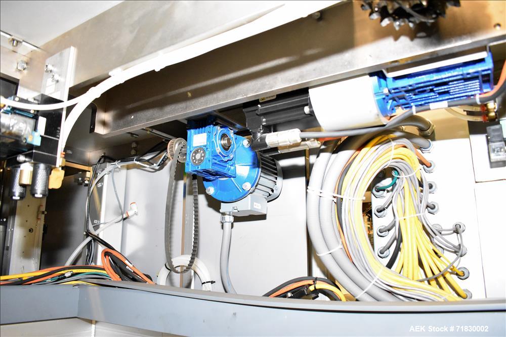 Used MGS Model TLC Top Load Cartoner with Robotic Pick and Place Unit.