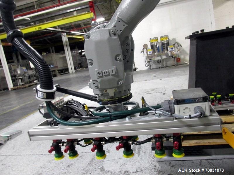 Used Motoman Robot Packaging Robotic Case Packaging System. Consisting of Motoman robotic arm, model MPL80, 5-point articulation with 80 kg max capacity serial# S06A62-1-2, with pallet conveyors and ...