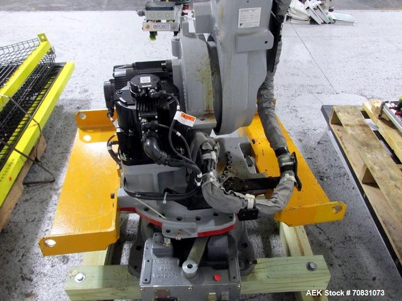 Used Motoman Robot Packaging Robotic Case Packaging System. Consisting of Motoman robotic arm, model MPL80, 5-point articulation with 80 kg max capacity serial# S06A62-1-2, with pallet conveyors and ...