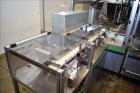Used MGS Model TLC Top Load Cartoner with Robotic Pick and Place Unit.