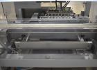 Used Bosch (Syntegon) Presto Robotic Top Load Robotic Carton loader. Capable of speeds up to 400 packages per minute. Has a product size range: Length 2