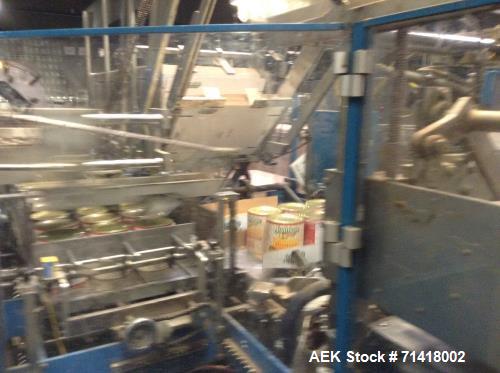 Used Douglas Case Packer, Model M-3409. 28-30 cases per minute, 128 oz. can/94 oz. can.