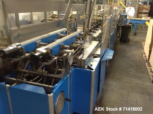 Used Douglas Case Packer, Model M-3409. 28-30 cases per minute, 128 oz. can/94 oz. can.