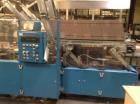 Used Douglas Case Packer, Model M-3409. 28-30 cases per minute, 128 oz. can/94 oz. can.