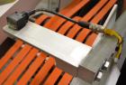 Used Fallas Automation Bag Collator, Model RW-1. Adjustable incline Eagle belting infeed, 8'' wide x 68'' long discharge belt conveyor. Includes a control panel with an Allen-Bradley Micrologix 1000,...