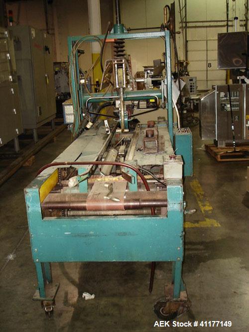 Used General Corrugated Hot Melt Top and Bottom Case Sealer, Model 2000. Includes a Nordson HM V glue unit, model 244305, Serial #A9G06461. 3/60/220V.