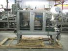 Used Wexxar Top Only Automatic Case Sealer, Model WST-07. Capable of speeds up to 35 cases per minute. Has a case size range: Length 12