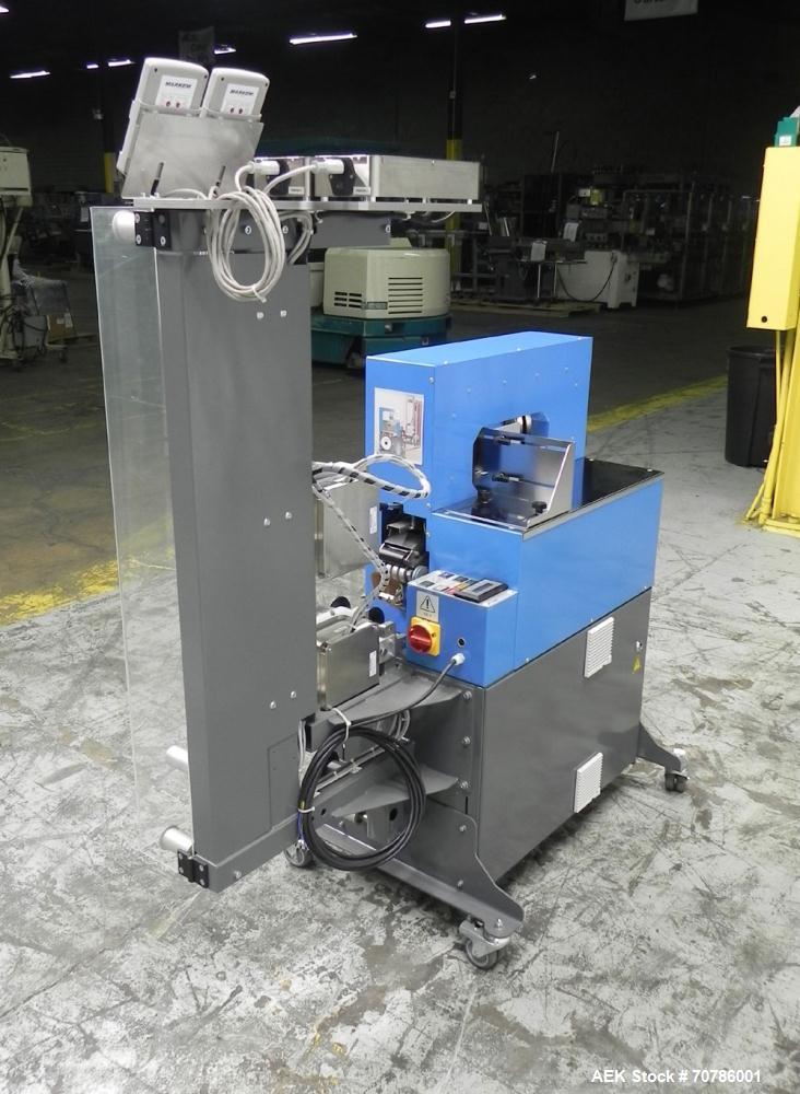 Unused- ATS (Felins) Model US-2100 Wide Format Banding Machine. Machine is capable of speeds up to 25-30 bandings per minute. Uses a "wide format" band width sizes of 3" (75mm) to 4" ( 100mm). Has an...