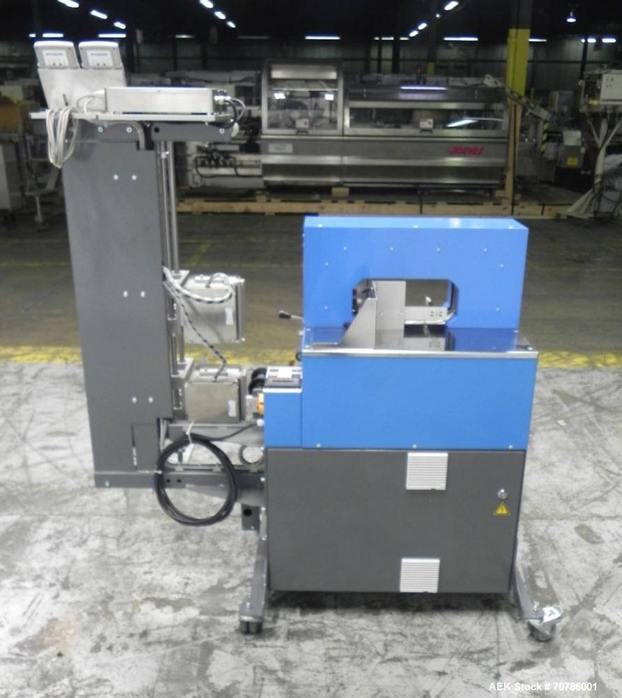 Unused- ATS (Felins) Model US-2100 Wide Format Banding Machine. Machine is capable of speeds up to 25-30 bandings per minute. Uses a "wide format" band width sizes of 3" (75mm) to 4" ( 100mm). Has an...