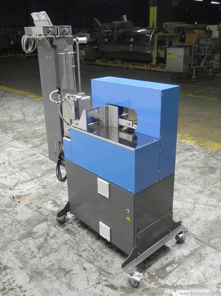 Unused- ATS (Felins) Model US-2100 Wide Format Banding Machine. Machine is capable of speeds up to 25-30 bandings per minute. Uses a "wide format" band width sizes of 3" (75mm) to 4" ( 100mm). Has an...