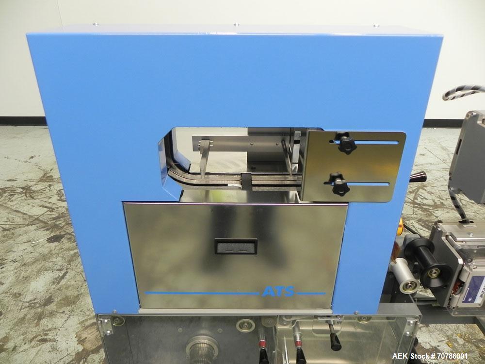 Unused- ATS (Felins) Model US-2100 Wide Format Banding Machine. Machine is capable of speeds up to 25-30 bandings per minute. Uses a "wide format" band width sizes of 3" (75mm) to 4" ( 100mm). Has an...