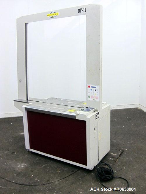 Used Dynaric Automatic Model DF-11 Bottom Seal Strapping Machine.Capable of 1.6 second cycle time, and up to 37 straps per minute. has an 'Arch' opening of 44.5" (wide) X 48"(tall).1/115 volt, 8.2 am...