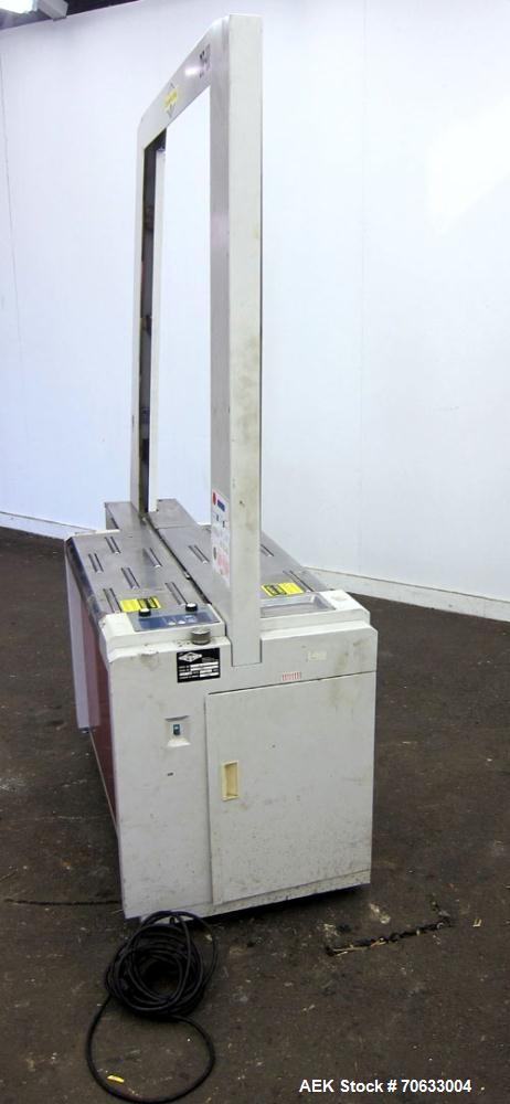 Used Dynaric Automatic Model DF-11 Bottom Seal Strapping Machine.Capable of 1.6 second cycle time, and up to 37 straps per minute. has an 'Arch' opening of 44.5" (wide) X 48"(tall).1/115 volt, 8.2 am...