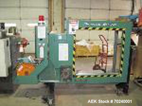 Used Signode Strapping Machine, Model SP710.  36" x 36" box, approximately 12 rolls of strapping, 220/3 phase.