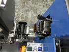Unused- ATS (Felins) Model US-2100 Wide Format Banding Machine. Machine is capable of speeds up to 25-30 bandings per minute. Uses a 