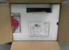 Unused- ATS (Felins) Model US-2100 Wide Format Banding Machine. Machine is capable of speeds up to 25-30 bandings per minute. Uses a 