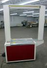 Used Dynaric Automatic Model DF-11 Bottom Seal Strapping Machine.Capable of 1.6 second cycle time, and up to 37 straps per minute. has an 'Arch' opening of 44.5