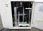 Used Dynaric Automatic Model DF-11 Bottom Seal Strapping Machine.Capable of 1.6 second cycle time, and up to 37 straps per minute. has an 'Arch' opening of 44.5