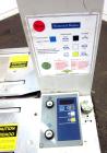 Used Dynaric Automatic Model DF-11 Bottom Seal Strapping Machine.Capable of 1.6 second cycle time, and up to 37 straps per minute. has an 'Arch' opening of 44.5