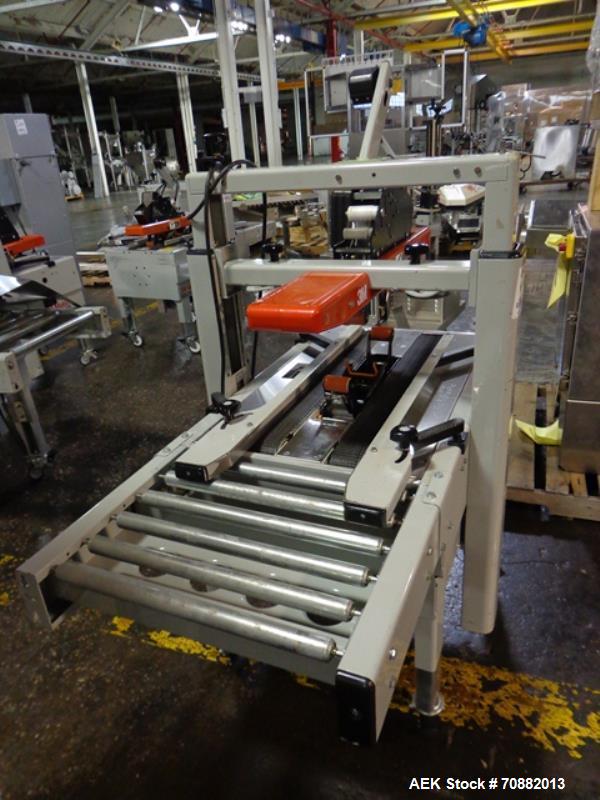 Used 3M Model 200A, Type 19000 Case Sealer. Top and bottom heads. Capable of speeds up to to 40 cases per minute, minimum case size 6" wide x 4.75" high x 6"' long, maximum case size 21.5" wide x 24....