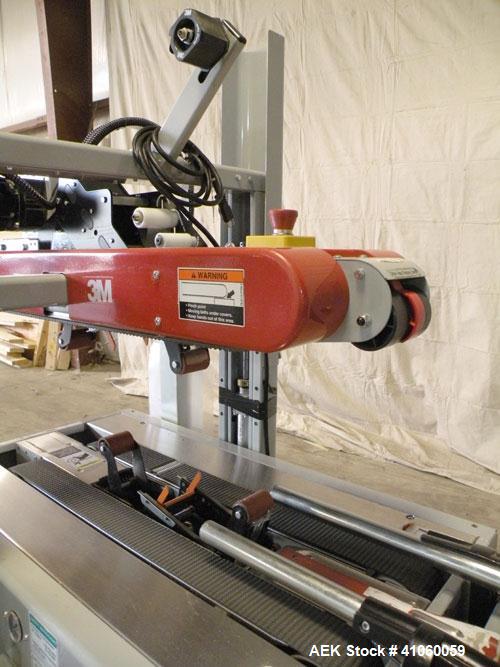 Used 3M-Matic Top And Bottom Random Case Sealer, Model 700R, Type 39600, Carbon Steel. Up to 15 cases per minute, minimum case size 6" wide x 4.75" high x 6" long, maximum case size 21.5" wide x 24.5...