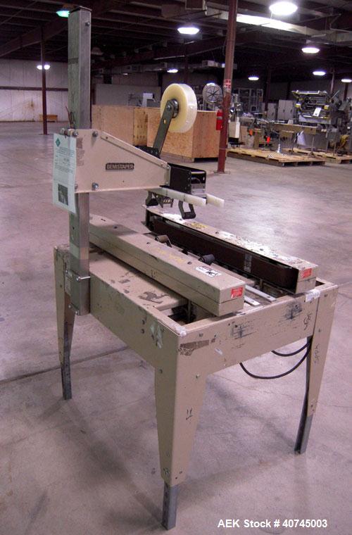 Used Bemis Semi-Automatic Uniform Top /Bottom Case Taper, Model 1018SA, carbon steel. Capable of speeds up to 28 CPM. Has side belt transfers and a case size range: length 4-1/2" to unlimited, height...