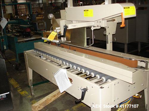 Used Bemis Case Sealer, Model 1022-SA00, Carbon Steel. Rated up to 28 cases per minute. Case size range: 6" - 24" long x 4-1/2" - 20" wide x 4-1/2" - 20" high. Fully auto side belt uniform case taper...