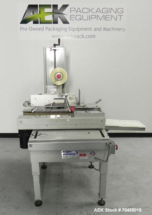 Used Durable Packaging Top and Bottom Case Sealer, Model RM-32A. Case size range: length 4-3/4" to infinite, width 4-3/4" to 20", and height 3-1/4" to 20". Maximum case weight 90 lbs [40 kg]. Tape Ap...
