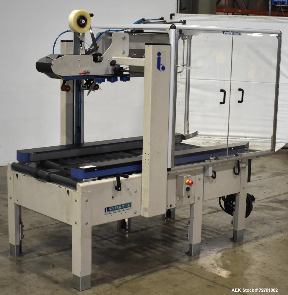 Used- Interpack UA 262024-SB Uniform Automatic Case Sealer. Capable of up to 12 cases per minute. Size range of 6 to 26" lon...