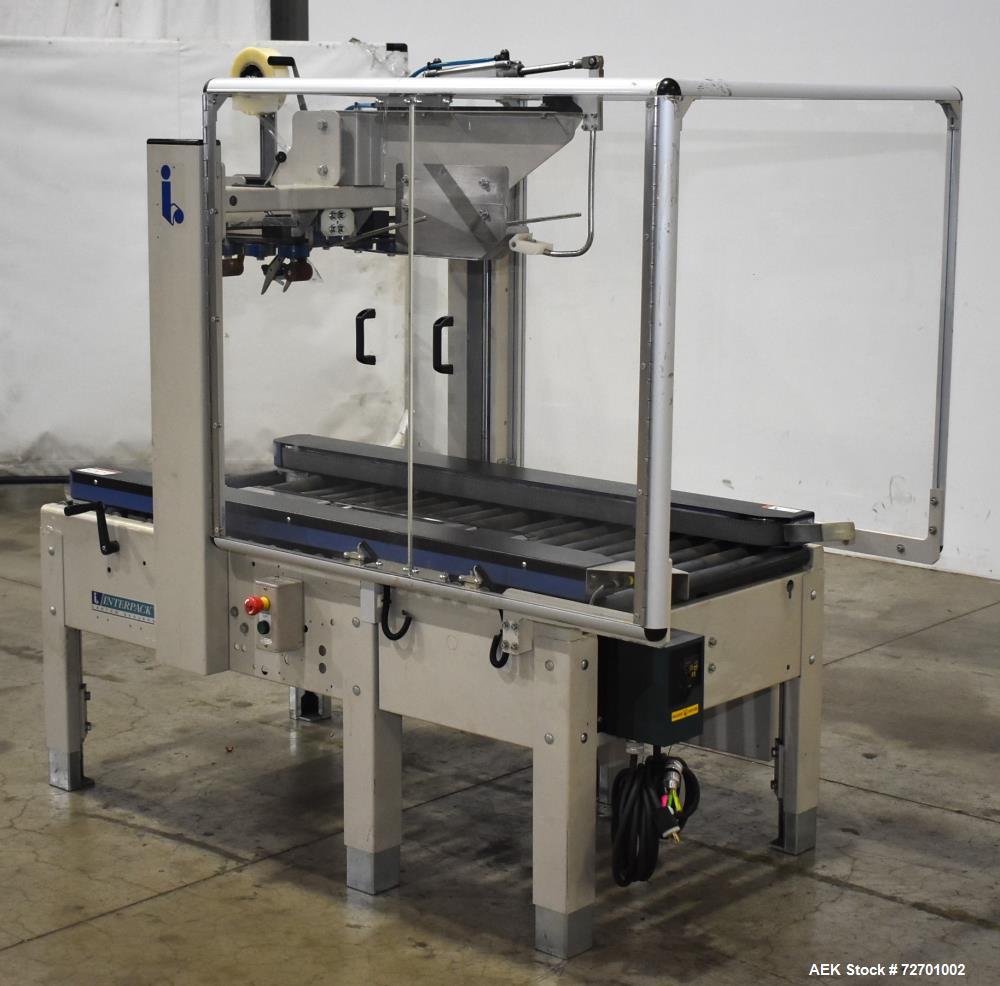 Used Interpack UA 262024-SB Uniform Automatic Case Sealer. Capable of up to 12 cases per minute. Size range of 6 to 26" long x 3.5 to 20" wide x 3.5 to 24" tall. 2" Wide top tape head. Side belt driv...