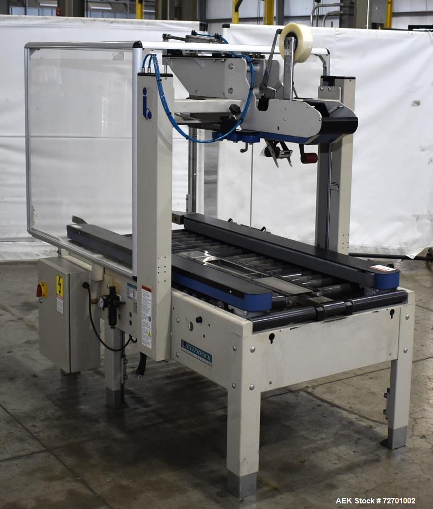 Used Interpack UA 262024-SB Uniform Automatic Case Sealer. Capable of up to 12 cases per minute. Size range of 6 to 26" long x 3.5 to 20" wide x 3.5 to 24" tall. 2" Wide top tape head. Side belt driv...