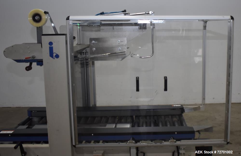 Used Interpack UA 262024-SB Uniform Automatic Case Sealer. Capable of up to 12 cases per minute. Size range of 6 to 26" long x 3.5 to 20" wide x 3.5 to 24" tall. 2" Wide top tape head. Side belt driv...