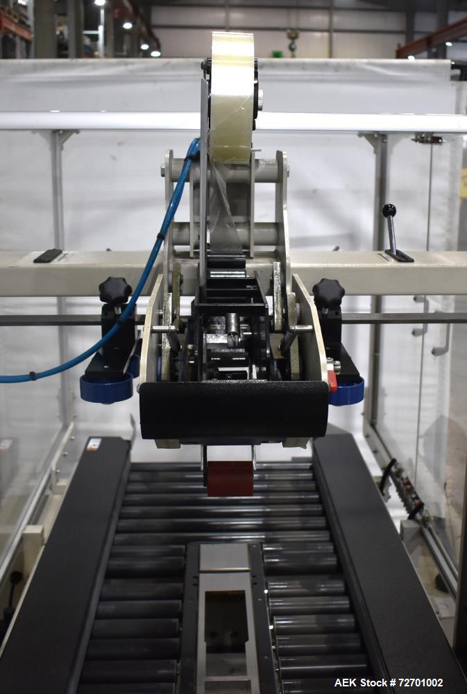 Used Interpack UA 262024-SB Uniform Automatic Case Sealer. Capable of up to 12 cases per minute. Size range of 6 to 26" long x 3.5 to 20" wide x 3.5 to 24" tall. 2" Wide top tape head. Side belt driv...