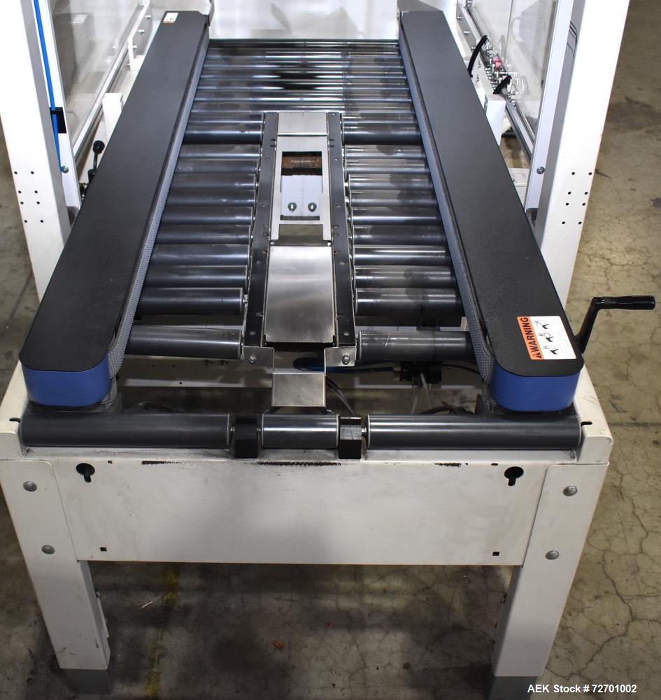 Used- Interpack UA 262024-SB Uniform Automatic Case Sealer. Capable of up to 12 cases per minute. Size range of 6 to 26" lon...