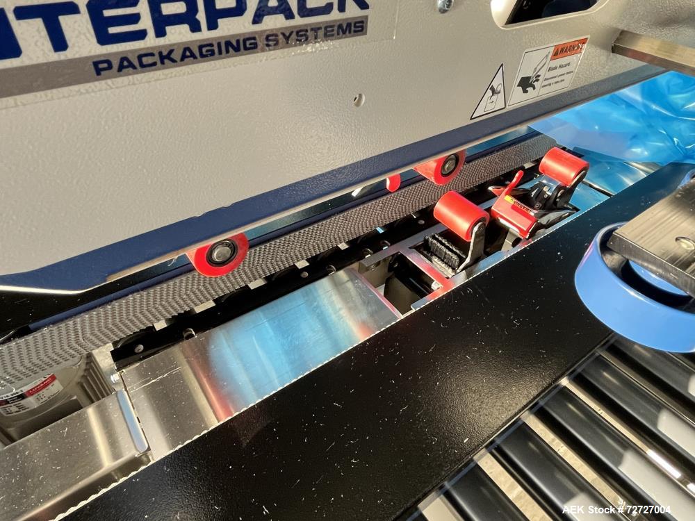 Used Interpack Top and Bottom Tape Case Sealer, Model USA20-SB-BO. Belt speed 82 feet per minute. Carton weight capacity up to 85lbs. Interpack HSD 2000-ET II standard tape head. Serial# TM 094 18B 0...