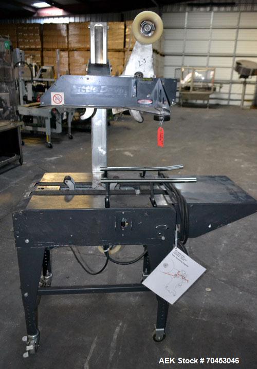 Used Little David Model LD3E Top & Bottom Tape Case Sealer. Capable of speeds up to 72' per minute. Can handle a case size range of: (width) 4-1/2" (114mm) to 24" (610mm). Uses pressure sensitive tap...