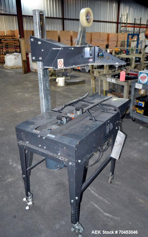 Used Little David Model LD3E Top & Bottom Tape Case Sealer. Capable of speeds up to 72' per minute. Can handle a case size range of: (width) 4-1/2" (114mm) to 24" (610mm). Uses pressure sensitive tap...