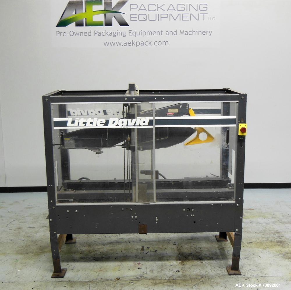 Used Loveshaw Little David Model LD16A Top and Bottom Automatic Case Sealer. Missing (1) tape head. Capable of speeds up to 60 feet per minute or 14 cases per minute. Case size range: (length) 8-1/2"...